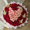 Heart-shaped bouquet of red and pink roses with gold butterfly picks