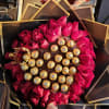 Bouquet of hot pink roses with Ferrero Rocher chocolates and a gold crown