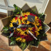 Sunflowers and red roses celebrate a milestone in Orgullo y Luz. A