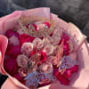 Pink and white rose bouquet with a jeweled crown and butterfly decorations