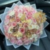 Bouquet of pink and white roses with gold butterfly decorations