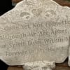 Decorative stone plaque with a heart and engraved quote