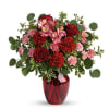 Tres belle! Ruby red roses and delicate pink alstroemeria are mixed with
