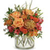 This warm-colored bouquet has orange bi-color roses, red alstroemeria, purple cushion spray