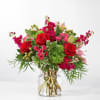 Red and pink mixed bouquet in a clear glass vase