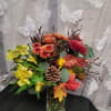 Mixed fall colors make this beautiful autumn arrangement 