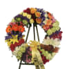 A very nice and colorful wreath made out of mixed flowers. 