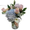 Soft, romantic, and effortlessly refined, the Blush &amp; Blue Elegance arrangement is