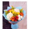 Bouquet of roses, hydrangeas, and yellow filler flowers wrapped in blue paper