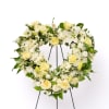 A timeless symbol of love and remembrance, this heart-shaped wreath offers a