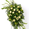 Elegant and timeless, this white and green spray offers a clean, natural