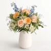  Our gathering of roses, Peruvian lilies, and other blooms evokes salt-kissed