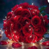Bouquet of red roses with string lights and scattered rose petals