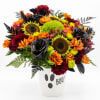 Halloween bouquet in a white vase with "BOO!" text