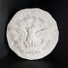 This 8in stone has a wall hook to display hanging, or lay