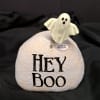 Decorative ghost-topped stone with "HEY BOO" text