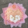 Pink rose bouquet with white orchids and a small crown topper