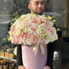 Large pastel rose bouquet in a pink hat box