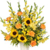 A wonderfully golden funeral arrangement in a vase (Different colors/flowers may be