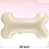 Cream bone-shaped balloon on a pink background with 30 inch text