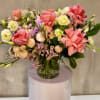 Mixed pink and cream bouquet in a glass vase