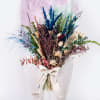 Dried bouquet with blue, purple, and pink stems tied with a white ribbon