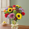 All-around arrangement with red roses and hypericum, autumn-colored roses, sunflowers, purple kale