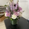 Pink and white mixed bouquet in a square glass vase