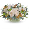 Cream roses and white flowers arranged in a pale green vase