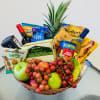 Gift basket with fruit, snacks, tea, and two bottles of wine