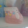 Pink ceramic baby bootie with colorful flower accents