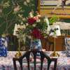 Floral centerpiece in a blue-and-white vase on a decorated table