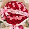 Bouquet of red and pink roses with a pink Happy Birthday ribbon