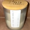Pop The Bubbly candle in a frosted glass jar with a bamboo lid
