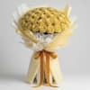 Bouquet of yellow roses wrapped in cream paper with an orange ribbon