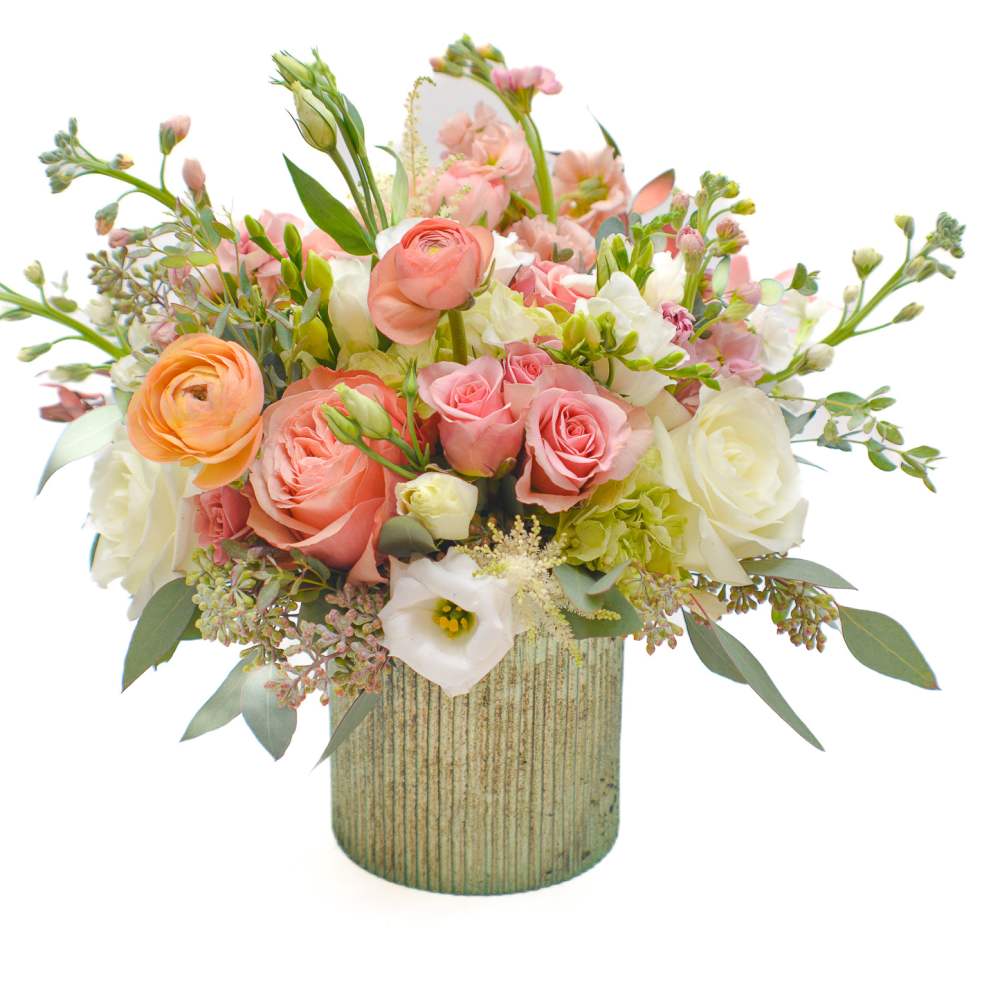 Pink and white mixed bouquet in a ribbed vase