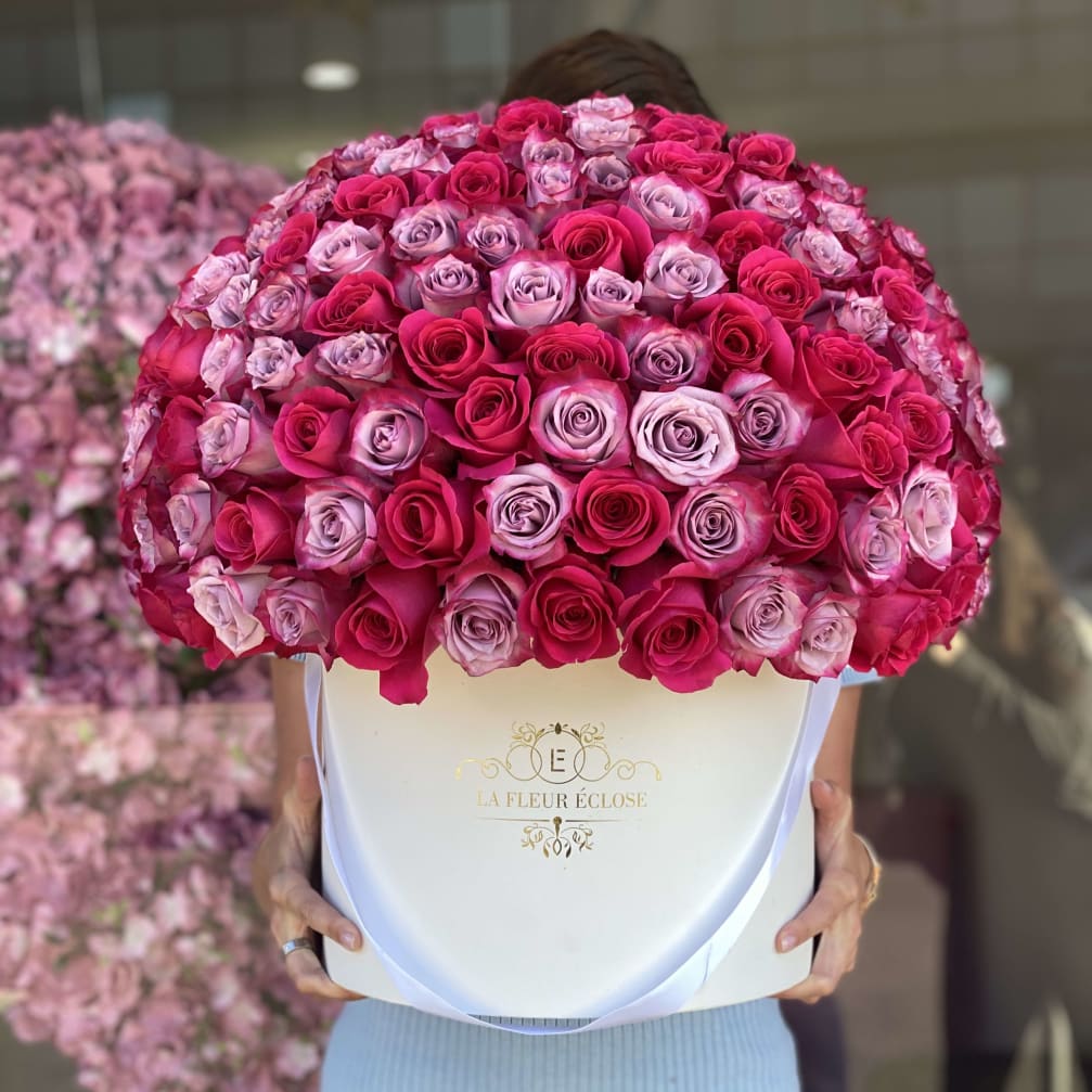 Large box arrangement of pink and lavender roses