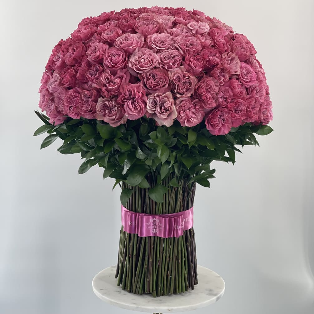Large dome bouquet of pink roses with a pink ribbon wrap