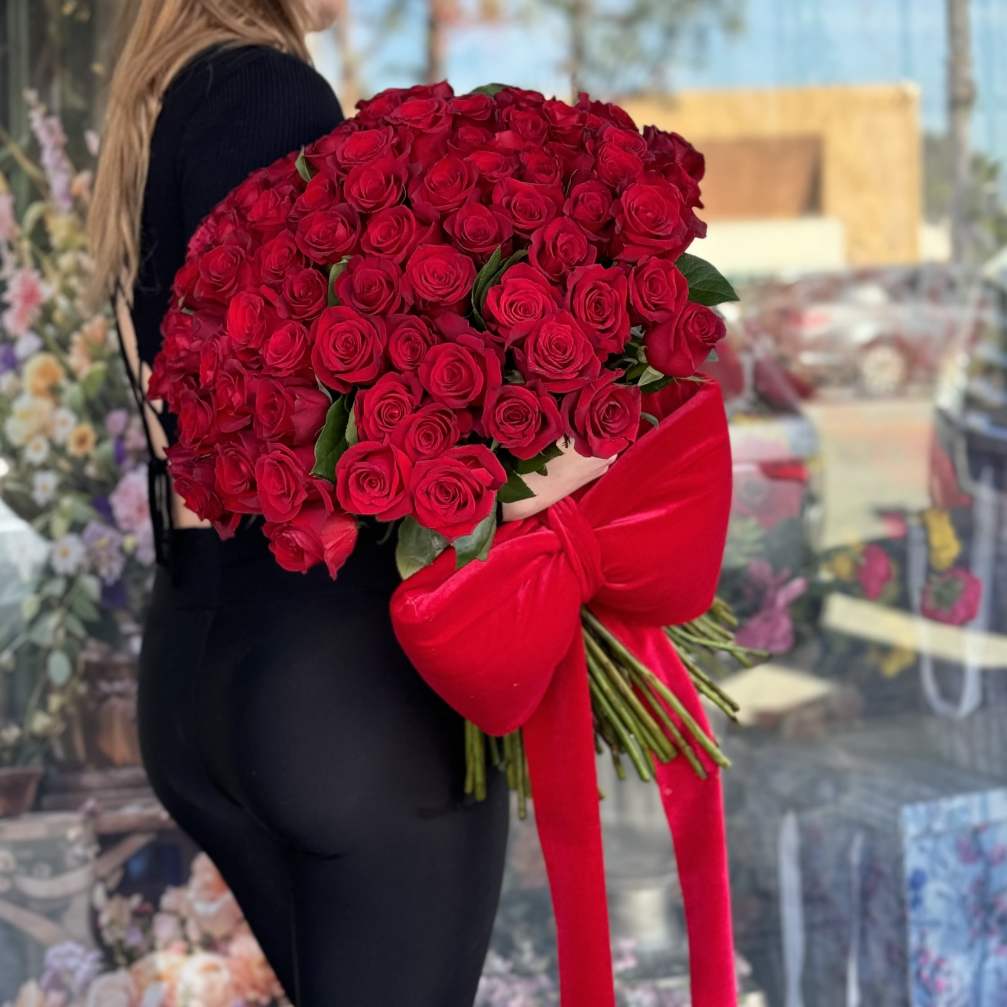 Large bouquet of red roses tied with a red bow