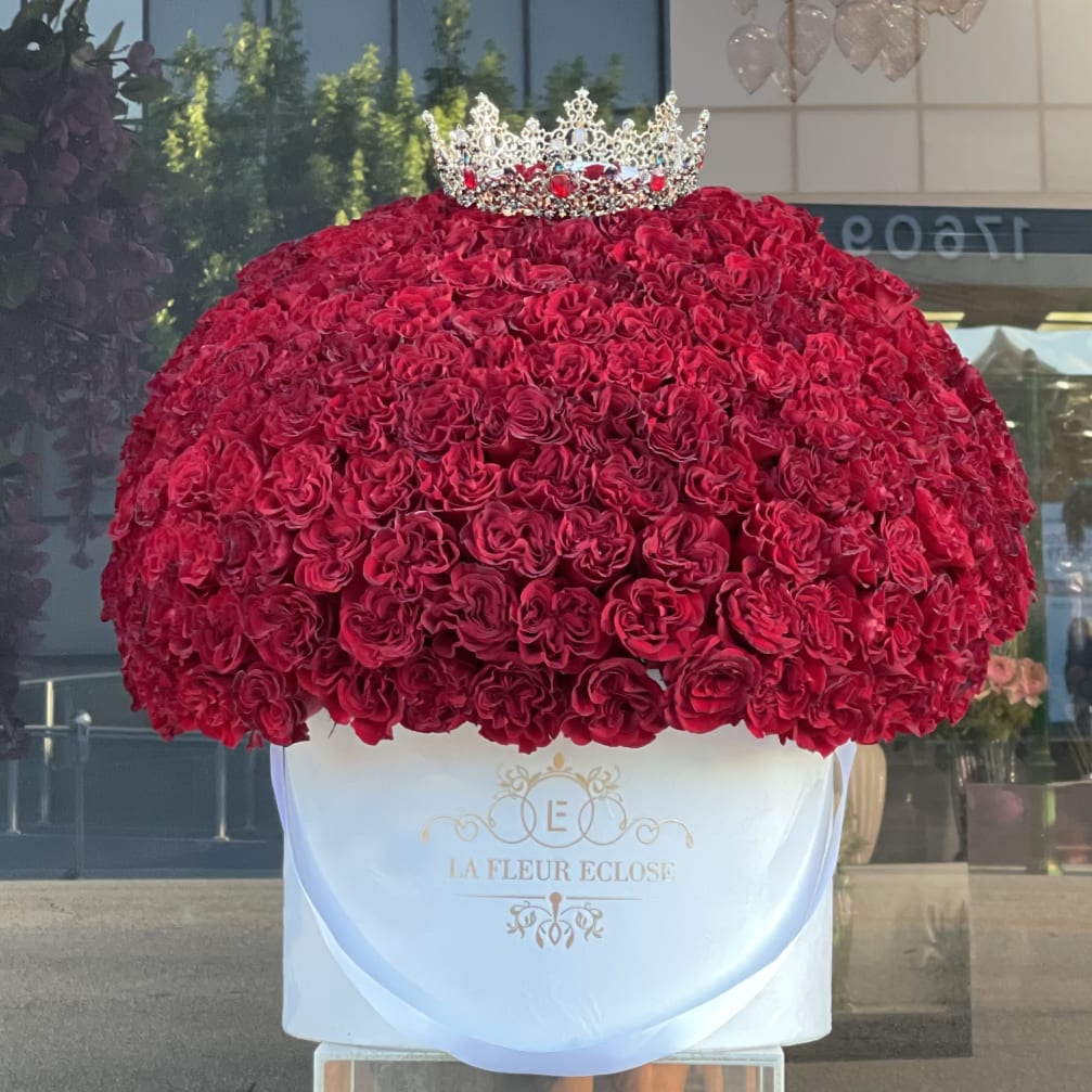 Large dome of red roses topped with a jeweled crown
