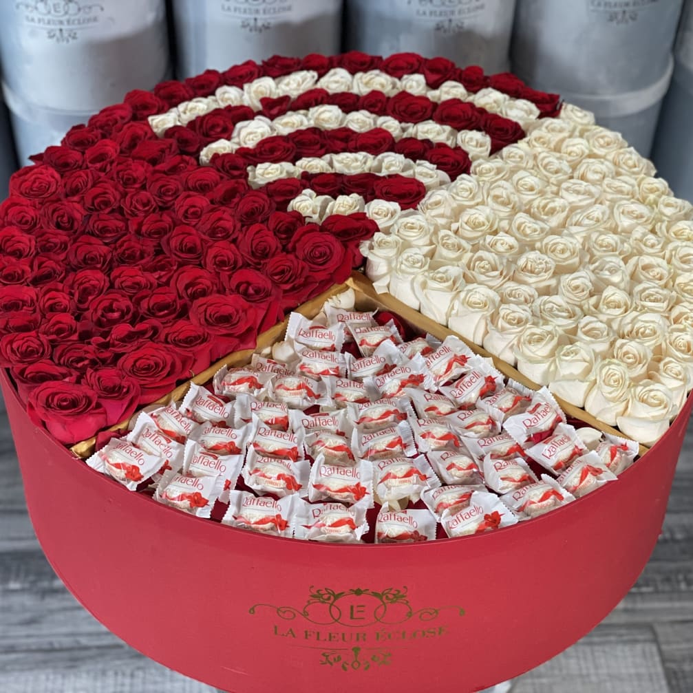 Heart-shaped box of red and white roses with Raffaello chocolates