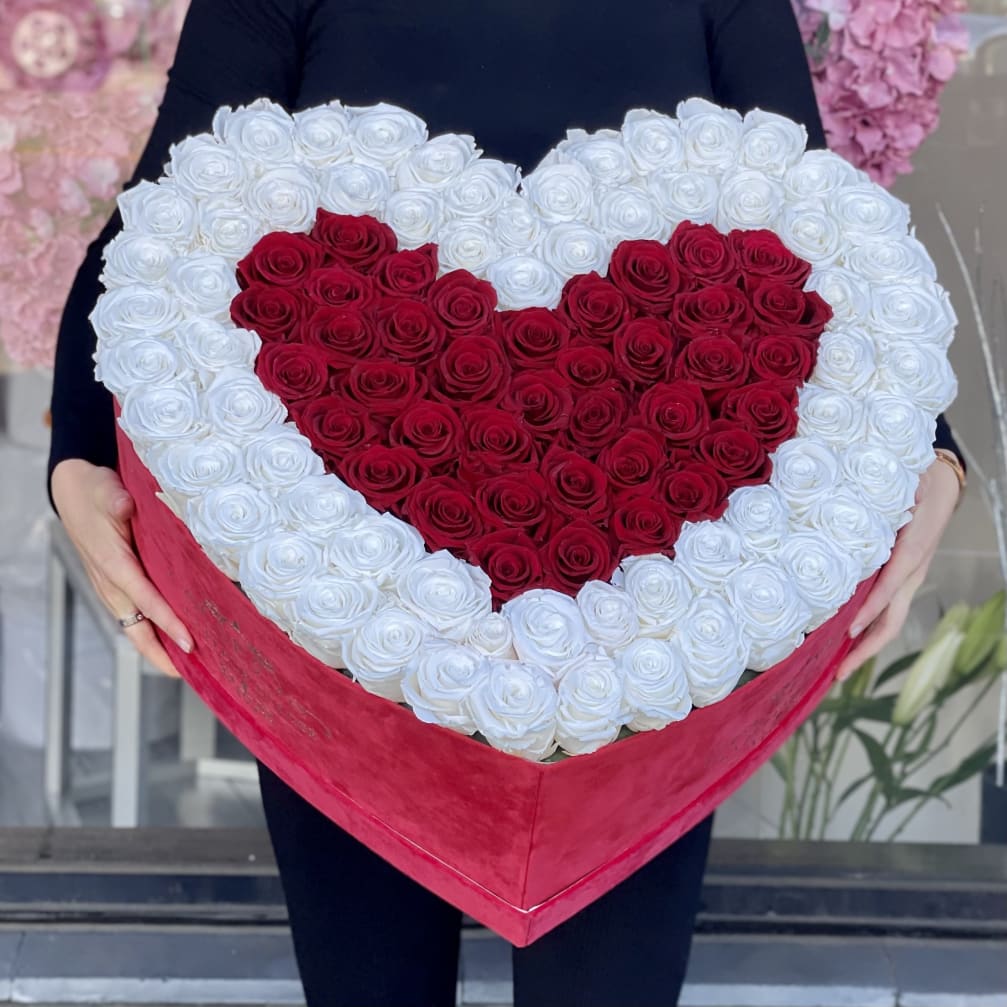 Heart-shaped box of red and white roses