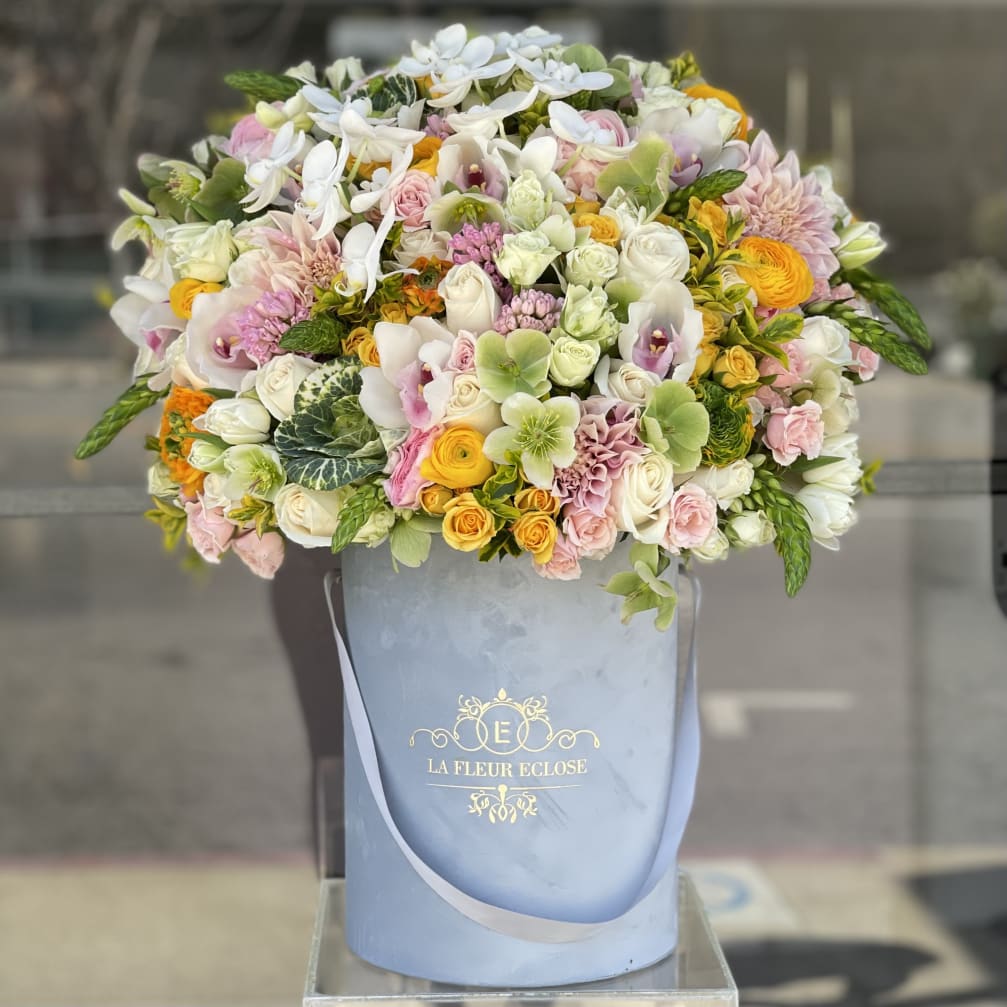 Large pastel bouquet in a blue hatbox with white and pink flowers