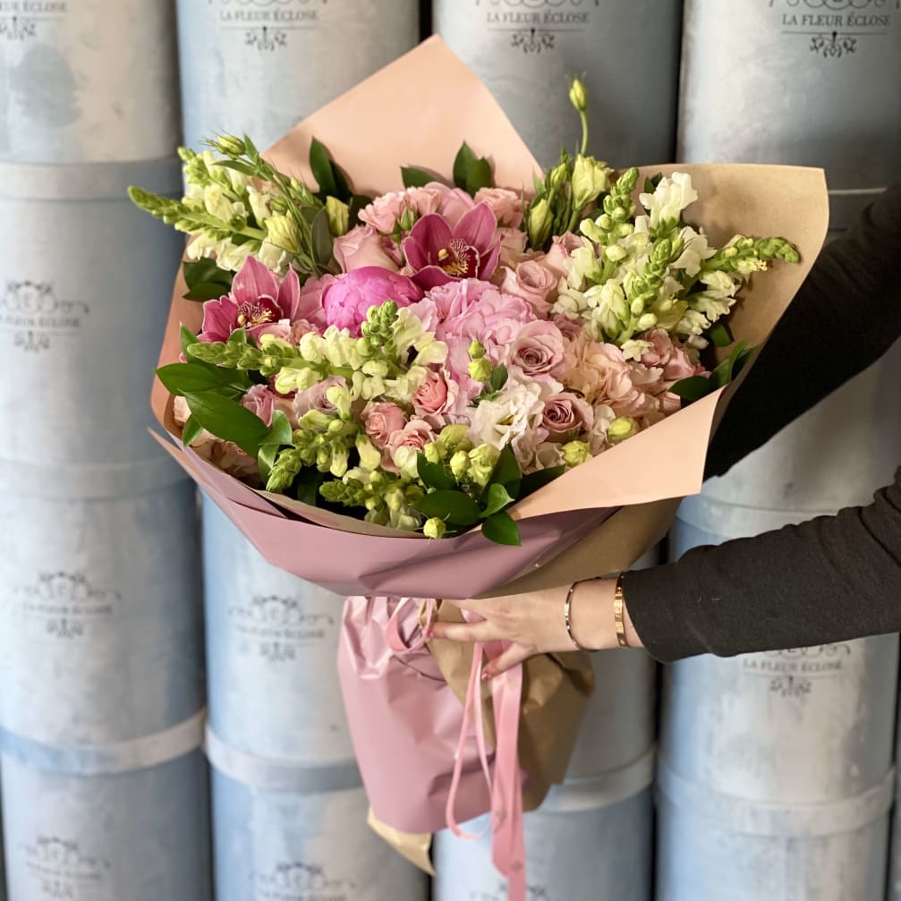 Pink and white mixed bouquet wrapped in pastel paper