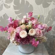 Pink and white bouquet in a white vase