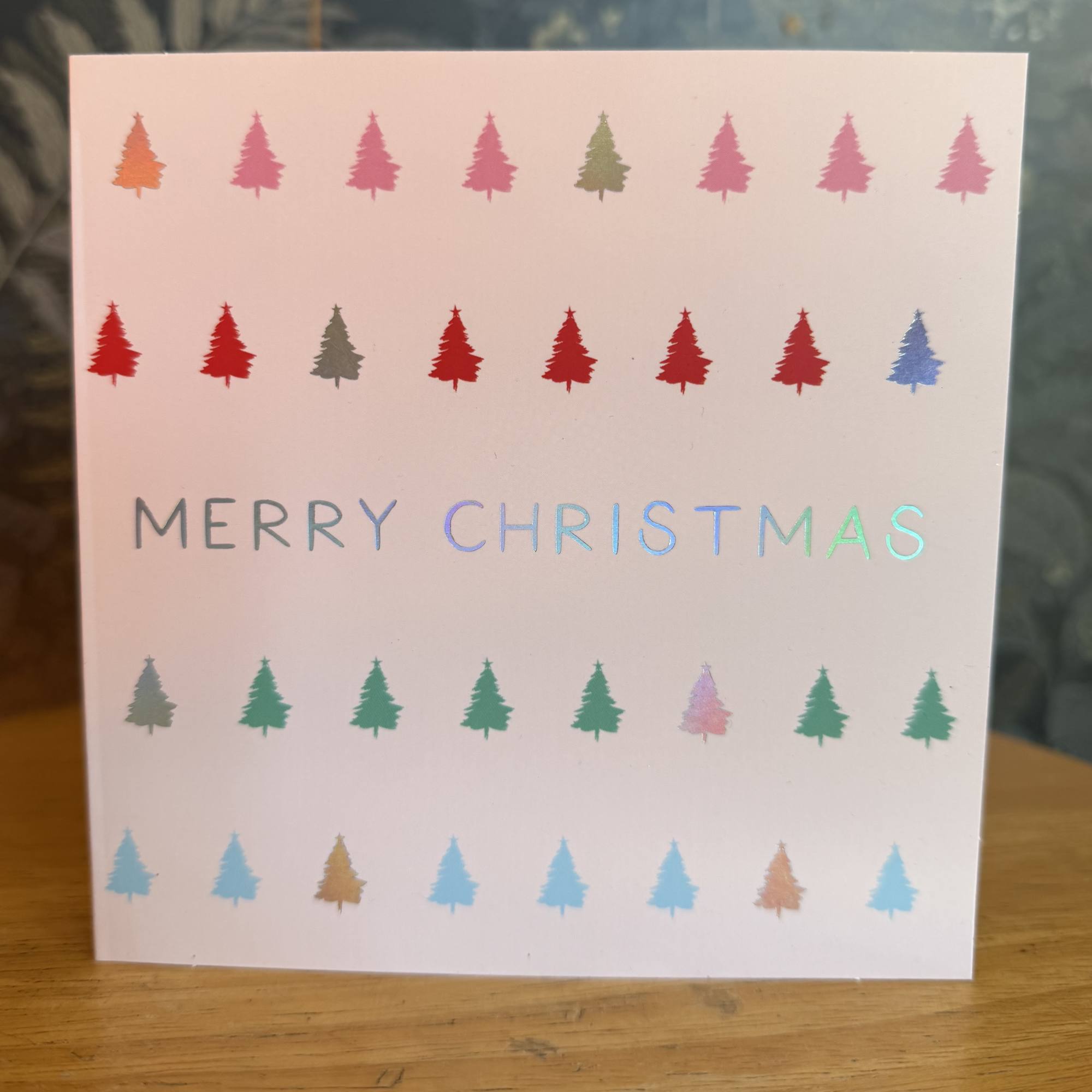 Christmas card with colorful tree icons and "Merry Christmas" text, photo 2 of 3