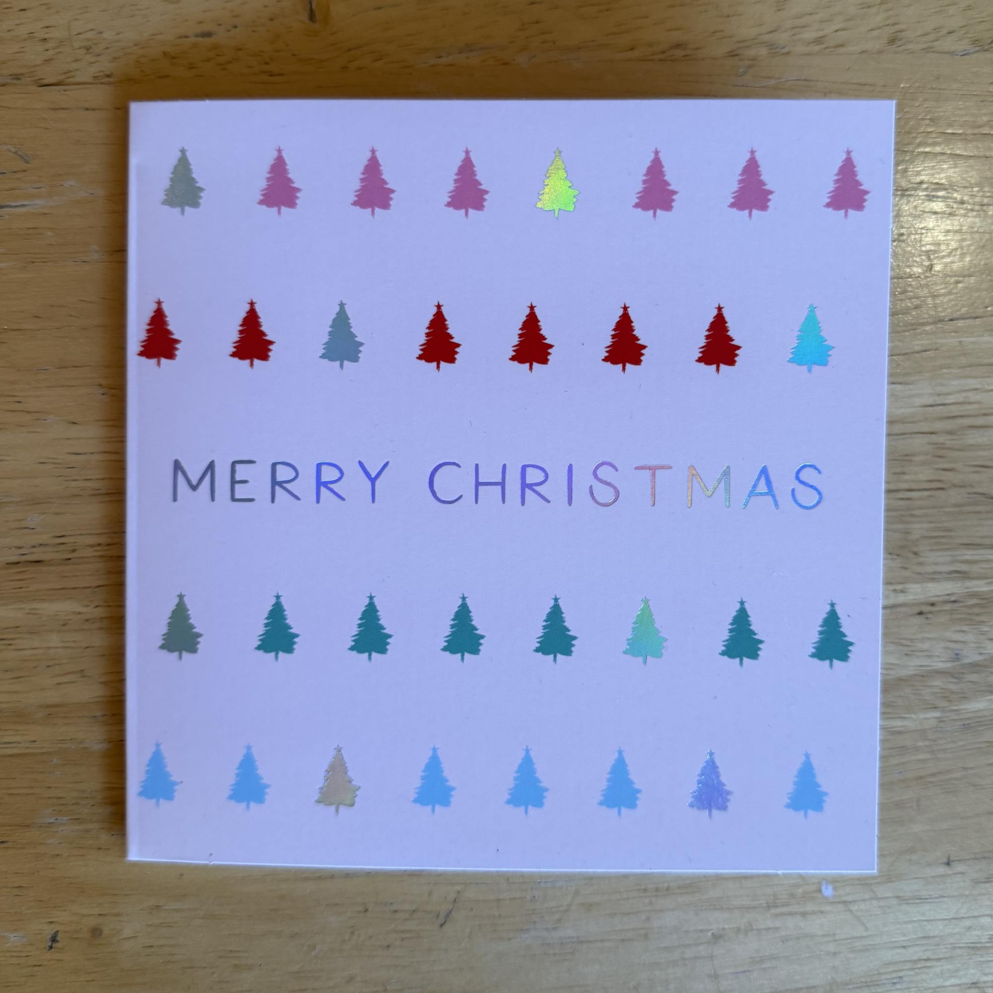Christmas card with colorful tree icons and "Merry Christmas" text, photo 3 of 3