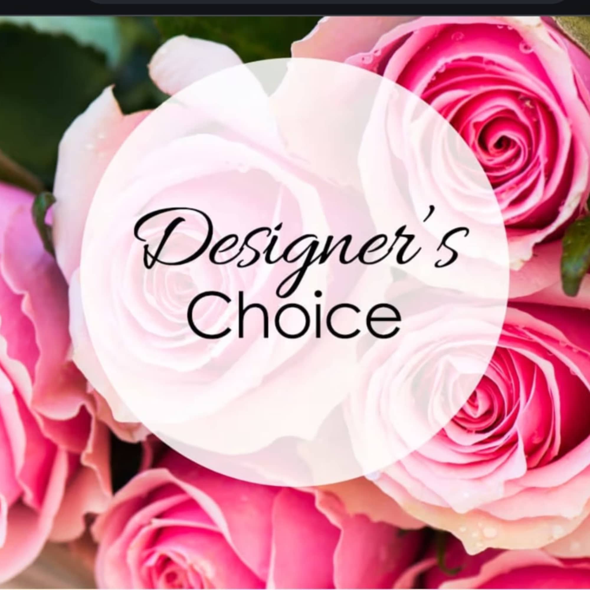 Pink roses with a "Designer’s Choice" label over the center