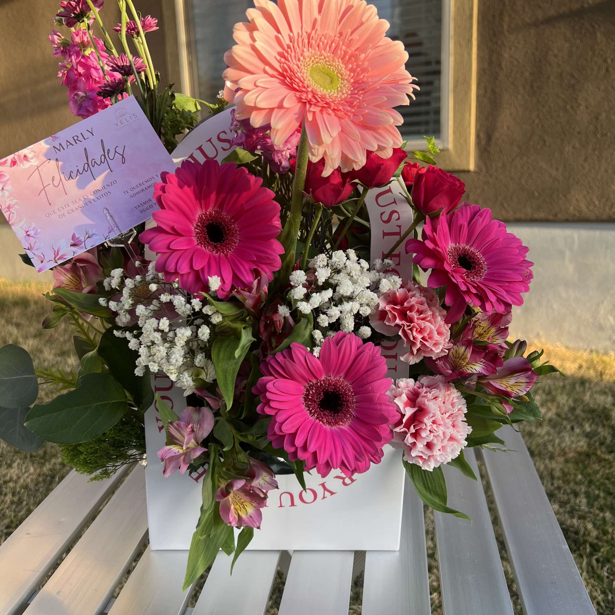 Bright pink and peach bouquet with gerbera daisies and carnations in a white box