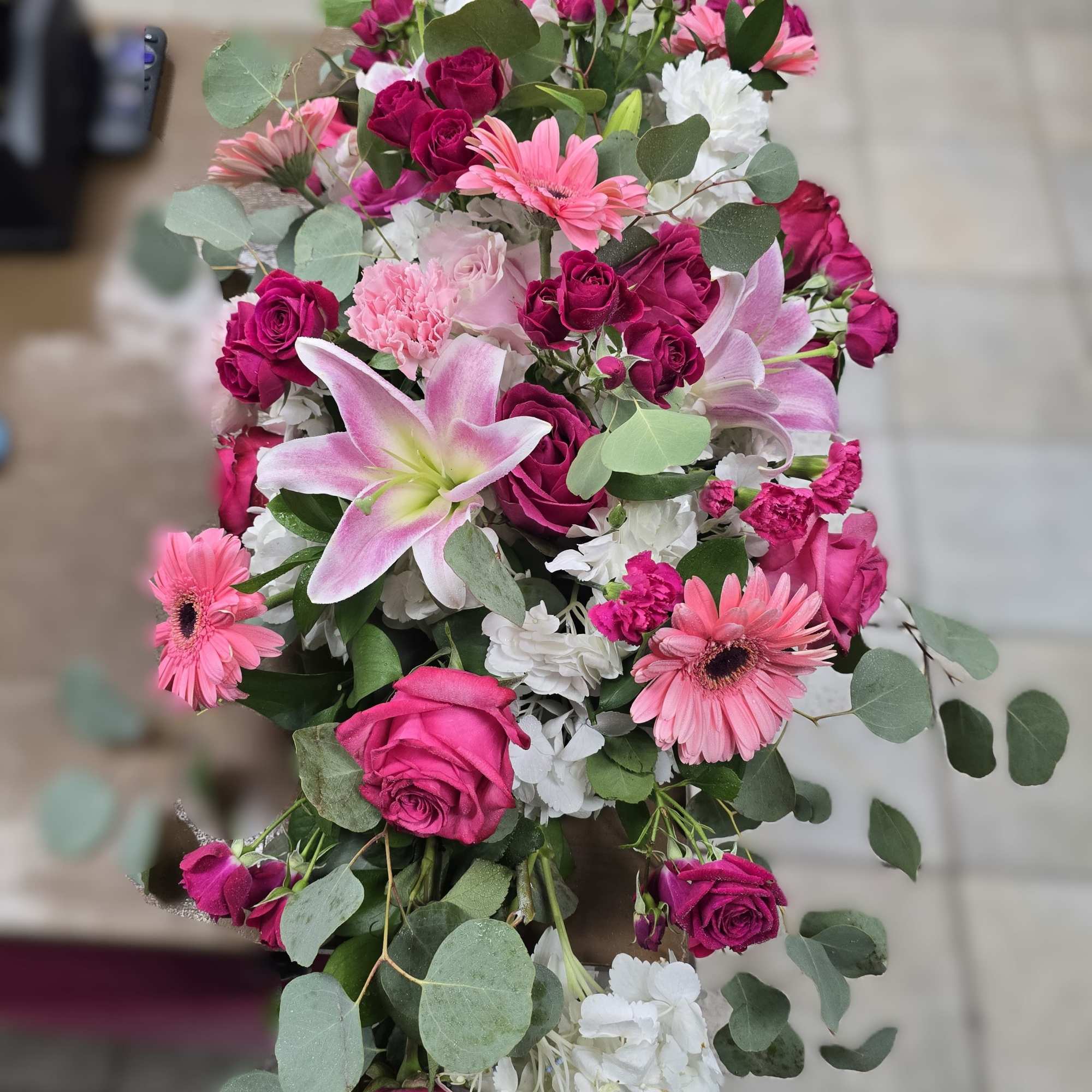 Bouquet of pink and white flowers with eucalyptus greenery